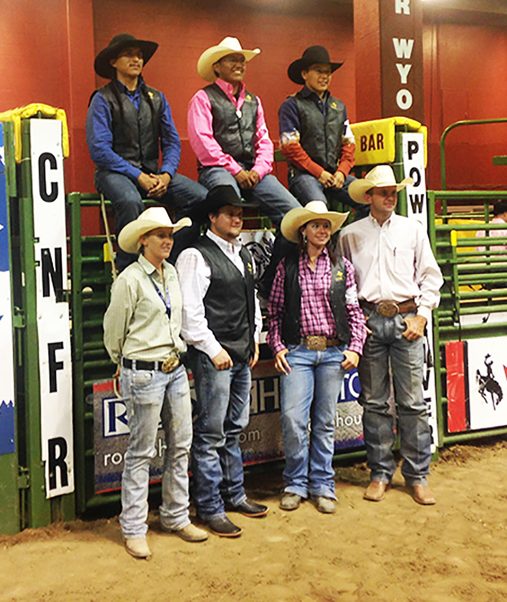 (top left to right) Edmiles Harvey (bareback riding); Chance Hunter (team roping); Adriano Long (bull riding); Staci Stanbrough, Assistant Rodeo Coach and Animal Science Faculty; Betty Pack (breakaway roping); and Tim Abbott, Intercollegiate Rodeo Coach at Mesalands Community College at the 2015 College National Finals Rodeo (CNFR) in the Casper Event Center in Casper, WY. 