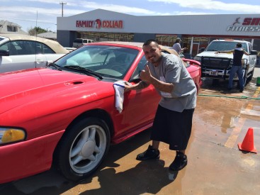 Marcos Martinez, President of the Hispanic Heritage Club ‘Amistad’ at Mesalands Community College, washing cars and having fun at their recent car wash, which raised over $200.