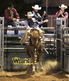 Caption. (Left) Clay Stremler claimed the reserve championship title in saddle bronc riding at the 8th Annual Mesalands Community College Fall Rodeo. Stremler is leading in the regional standings with a total of 450 points.