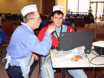 Caption. (left) Michael Bilopavlovich, Client Support Manager at Mesalands Community College and Josue Grajeda, student at Tucumcari High School and Dual Student at Mesalands, begin the preparation for the unveiling of the memorial website for Patrick Gonzales, during a special event at Mesalands last week.