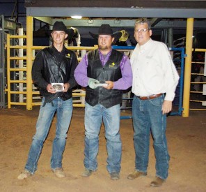 Members of the Mesalands Community College Rodeo Team Koly Ray Spears and Jacob Rounds, showcase their team roping championship titles they won at the Mesalands Spring Rodeo last weekend at the Quay County Rodeo Arena, with Dr. Thomas W. Newsom, President of Mesalands.