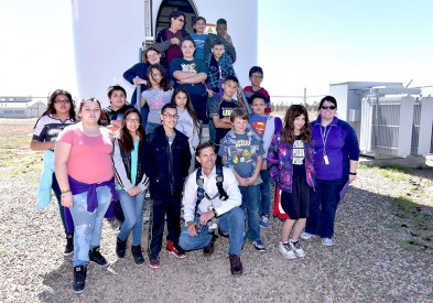 A sixth grade science class at Tucumcari Middle School meets with the Senator after his climb.