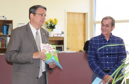 (left) Dr. Thomas W. Newsom, President of Mesalands Community College, talks about the importance of reading to the attendees of last week’s installation ceremony. He also stated that one of his favorite children’s books is “If You Give A Mouse A Cookie.”