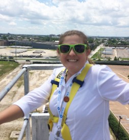 Casey West takes a ride on a lift truck approximately 350 feet high, with New Orleans, LA in the background, at the 2016 AWEA Windpower Conference and Exhibition. 