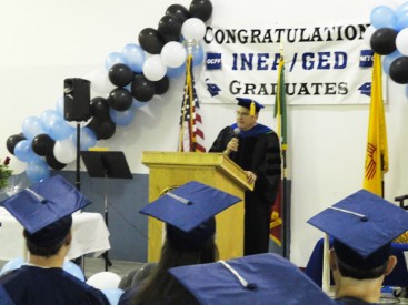 Dr. Thomas W. Newsom, President of Mesalands Community College, encourages the recent graduates at the Otero County Prison Facility, to find their potential for future success during the graduation ceremony.