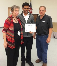 Dr. Joanne Peeples, Executive Board Member of NMMATYC from El Paso Community College and Dr. Philip Kaatz, Mathematics/Physical Science Faculty at Mesalands Community College, presents Yash Shah with his scholarship award at the 27th Annual NMMATYC Conference.