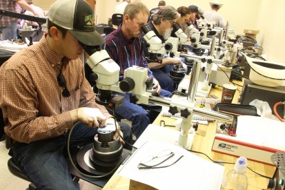 Students in the advanced Artistic Silversmithing course, utilize the engraving machines to test out some of the new unique engraving techniques that they learned during the one-week workshop at Mesalands Community College. 