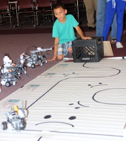 Taylor Enriquez shows the capabilities of the robot he developed during the Robotics Academy at Mesalands Community College, presented by the Robotics Club.